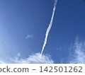 Condensation Trail in the Sky on a Bright, Clear Day 142501262