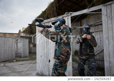 Group of soldiers preparing for the attack together, while aiming, using their weapons Group of soldiers preparing for the attack together, while aiming, using their weapons 142504267