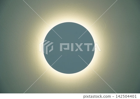 Minimalist round wall light with glowing neon halo effect Minimalist round wall light with glowing neon halo effect 142504401