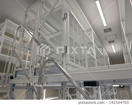 Many steel shelves and railings in the warehouse Many steel shelves and railings in the warehouse 142504703