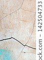 Weathered Cracked Wall with Blue Accent Texture 142504733