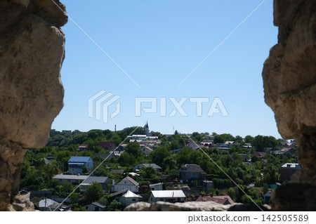 Panoramic View of Residential District in Kamianets Podilskyi Ukraine Framed by Ancient Stone Walls of Historic Architecture Panoramic View of Residential District in Kamianets Podilskyi Ukraine Framed by Ancient Stone Walls of Historic Architecture 142505589