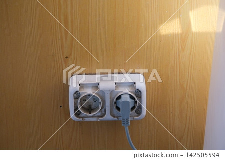 Dirty Electrical Wall Socket with Black Grime Dust and Stains Around Plug Showing Neglected Outlet and Poor Household Cleaning Dirty Electrical Wall Socket with Black Grime Dust and Stains Around Plug Showing Neglected Outlet and Poor Household Cleaning 142505594