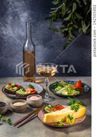 Gourmet cheese and salmon appetizers with rose wine pairing Gourmet cheese and salmon appetizers with rose wine pairing 142505802