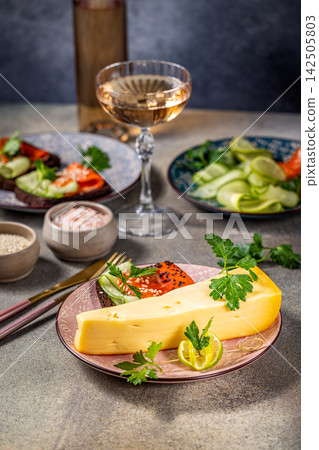 Gourmet cheese, smoked salmon canapes and rose wine creating elegant appetizer platter Gourmet cheese, smoked salmon canapes and rose wine creating elegant appetizer platter 142505803