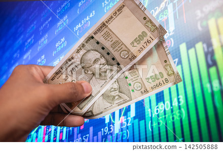 Indian 500 rupee banknotes placed on Indian flag Background Indian 500 rupee banknotes placed on Indian flag Background 142505888