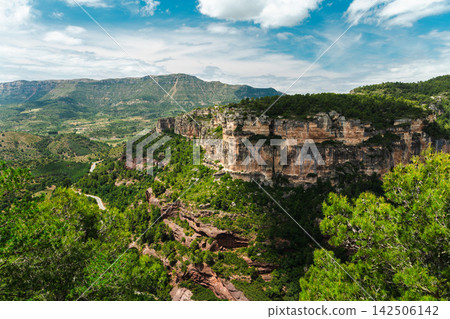 Siurana canyon and sandstone cliffs overlooking mountain valley in Catalonia, Spain Siurana canyon and sandstone cliffs overlooking mountain valley in Catalonia, Spain 142506142