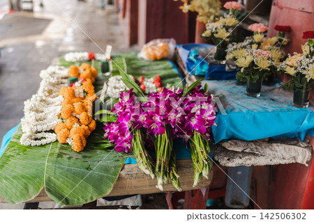 Colorful Orchid Bouquets and Garlands at Bangkok Street Flower Stall Colorful Orchid Bouquets and Garlands at Bangkok Street Flower Stall 142506302