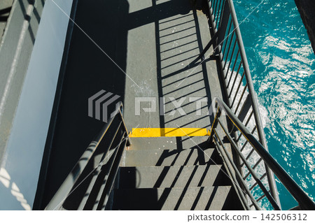 Ferry Staircase Above Sparkling Turquoise Sea Ferry Staircase Above Sparkling Turquoise Sea 142506312