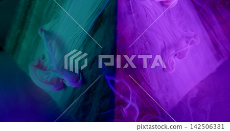 Acrylic fluid. Paint liquid. Defocused purple blue neon colorful wet creative blend pyramid in water spreading on abstract art background. Acrylic fluid. Paint liquid. Defocused purple blue neon colorful wet creative blend pyramid in water spreading on abstract art background. 142506381
