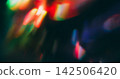 Blur circles. Red light. Defocused vibrant blue green color optical gleam glisten reflection on abstract bokeh bright illuminated background. 142506420