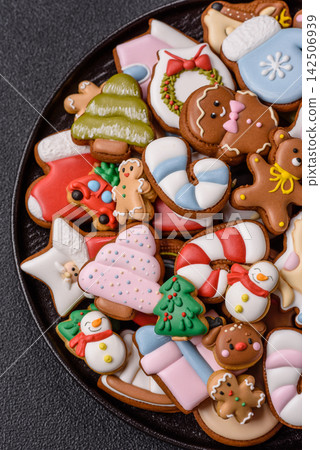 Gingerbread as a Christmas staple, sweets for the holiday interior. Gingerbread as a background Gingerbread as a Christmas staple, sweets for the holiday interior. Gingerbread as a background 142506939
