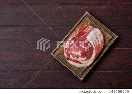 Slices of pork pancetta, ham, or bacon for a festive antipasto platter Slices of pork pancetta, ham, or bacon for a festive antipasto platter 142506959