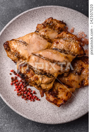 Grilled chicken breast seasoned with salt and spices. Grilled chicken Grilled chicken breast seasoned with salt and spices. Grilled chicken 142507020