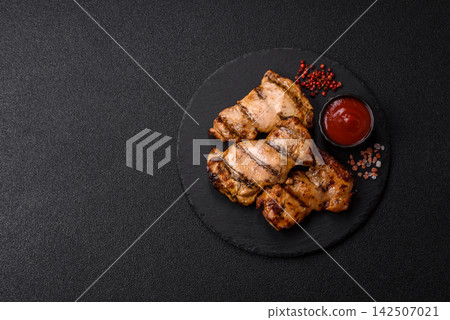 Grilled chicken breast seasoned with salt and spices. Grilled chicken Grilled chicken breast seasoned with salt and spices. Grilled chicken 142507021