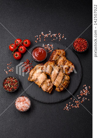 Grilled chicken breast seasoned with salt and spices. Grilled chicken Grilled chicken breast seasoned with salt and spices. Grilled chicken 142507022