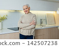 Portrait of confident stylish European middle aged senior woman. Older mature 60s lady smiling at home. Happy attractive senior female looking camera close up face headshot portrait. Happy people 142507238
