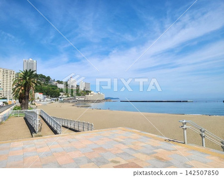 The sandy beach and resort scenery of Atami Sun Beach, with its clear blue sky and calm sea (copy space) The sandy beach and resort scenery of Atami Sun Beach, with its clear blue sky and calm sea (copy space) 142507850