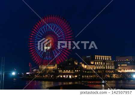 Ferris wheel illuminated at night in Yokohama. Japan Ferris wheel illuminated at night in Yokohama. Japan 142507957