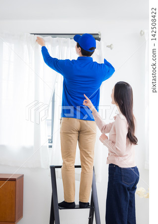 Curtain installation staff Curtain installation staff 142508422