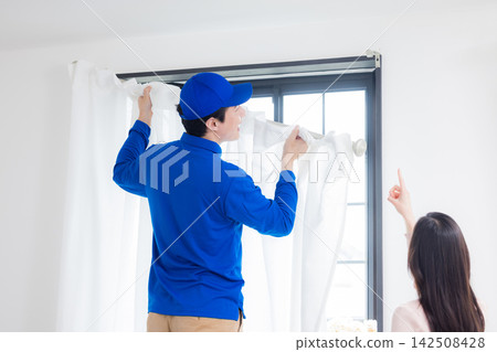 Curtain installation staff Curtain installation staff 142508428