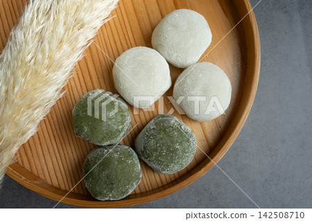 Autumn: Moon-viewing dumplings served on a wooden tray Autumn: Moon-viewing dumplings served on a wooden tray 142508710