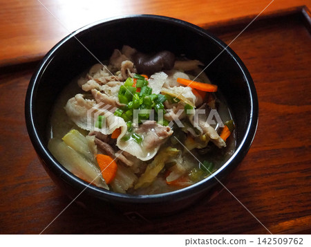 Pork soup with lots of ingredients served on a tray Pork soup with lots of ingredients served on a tray 142509762