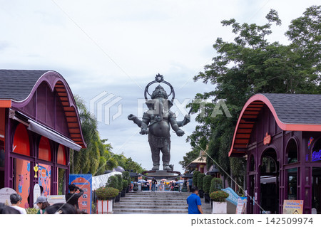 Large standing Lord Ganesha bronze sculpture against blue sky, famous landmark in Chachoengsao, Thailand Large standing Lord Ganesha bronze sculpture against blue sky, famous landmark in Chachoengsao, Thailand 142509974