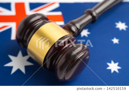 Australia, Legal, justice and agreement, wooden court gavel on flag. Australia, Legal, justice and agreement, wooden court gavel on flag. 142510159