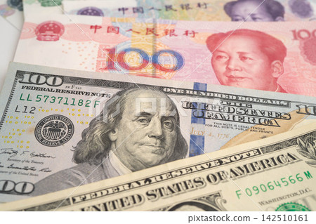 China yuan and dollar banknote money, investment economy business and banking. China yuan and dollar banknote money, investment economy business and banking. 142510161