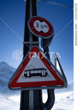 Unique road signs and infrastructure installed on the snowfields of a ski resort. Unique road signs and infrastructure installed on the snowfields of a ski resort. 142510379