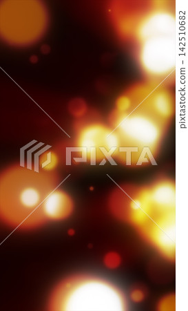 Abstract defocused bokeh lights in glowing red, orange, yellow, and white tones creating a warm festive background. 142510682