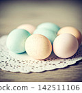 fresh eggs on wooden background 142511106