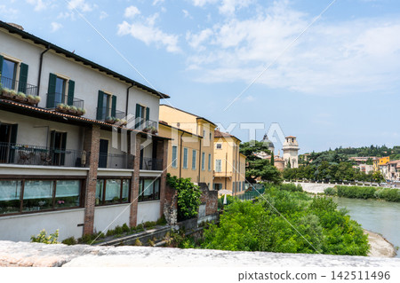 View of Historical Waterfront Buildings and Adige River in Verona City Italy View of Historical Waterfront Buildings and Adige River in Verona City Italy 142511496