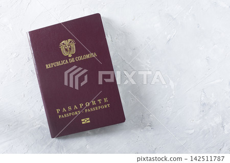 passport of colombia seen from above, on white background passport of colombia seen from above, on white background 142511787