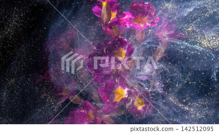 Pink and yellow orchid blossoms suspended in shimmering ink swirl with glittery particles Pink and yellow orchid blossoms suspended in shimmering ink swirl with glittery particles 142512095