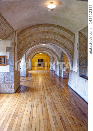 Vaulted Stone Arches and Hardwood Floor in Castle Corridor Vaulted Stone Arches and Hardwood Floor in Castle Corridor 142512355