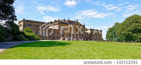 Front Facade of Palladian Style Stourhead House with Visitors on Lawn 142512391