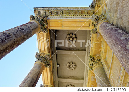 Low Angle View of Classical Corinthian Columns and Coffered Ceiling Portico Low Angle View of Classical Corinthian Columns and Coffered Ceiling Portico 142512393
