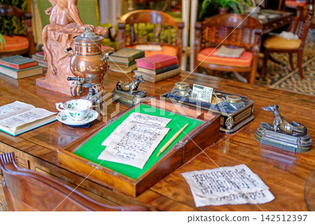 Historic Writing Desk with Antique Stationary Letters and Brass Urn Historic Writing Desk with Antique Stationary Letters and Brass Urn 142512397