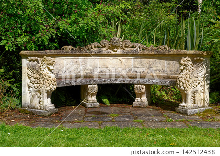 Antique Curved Stone Lion Bench at Knightshayes Court Gardens Antique Curved Stone Lion Bench at Knightshayes Court Gardens 142512438