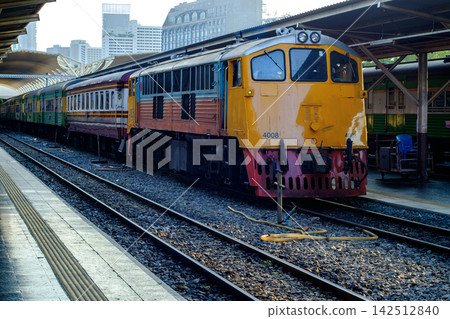 Vintage Yellow Locomotive at Train Station Platform in Evening Light Vintage Yellow Locomotive at Train Station Platform in Evening Light 142512840