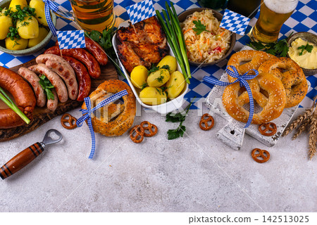 Oktoberfest food: beer, pretzel, sausages, stewed cabbage, potato Oktoberfest food: beer, pretzel, sausages, stewed cabbage, potato 142513025