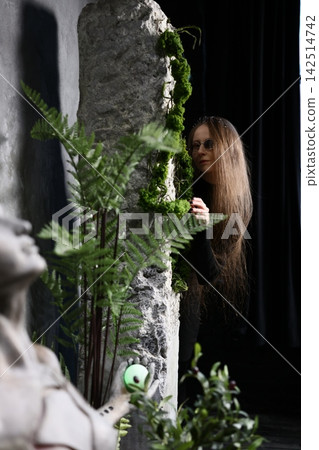 Tranquil sloth nestled among vibrant ferns beneath gentle lighting Tranquil sloth nestled among vibrant ferns beneath gentle lighting 142514742