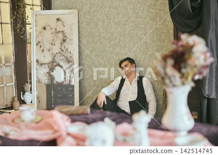 Reflective writer amid rustic and artistic surroundings Reflective writer amid rustic and artistic surroundings 142514745