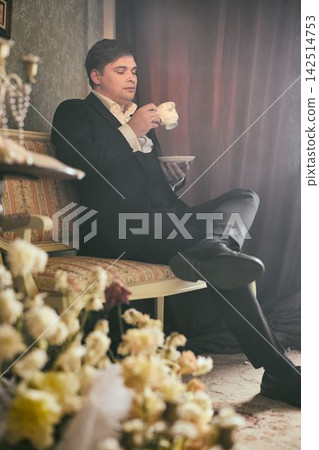 Poignant scene of author surrounded by flowers and tranquil setting Poignant scene of author surrounded by flowers and tranquil setting 142514753