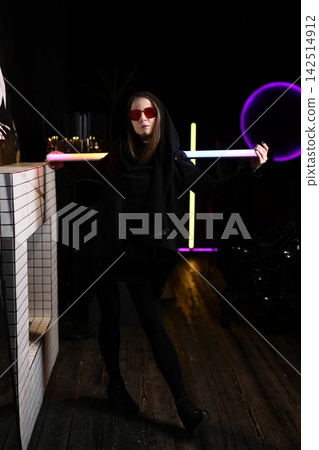 Juggling with lights. Performing fluid tube juggling show Juggling with lights. Performing fluid tube juggling show 142514912