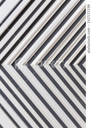 white plastic slats forming a repeating diagonal pattern white plastic slats forming a repeating diagonal pattern 142515296