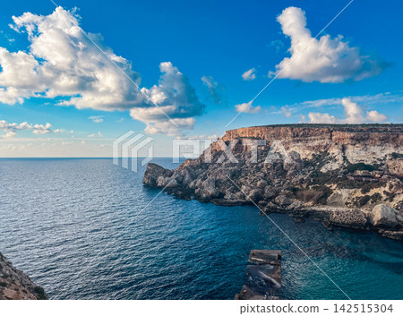 Deep Blue Waters and Coastal Cliffs at Anchor Bay Mellieha Malta Deep Blue Waters and Coastal Cliffs at Anchor Bay Mellieha Malta 142515304