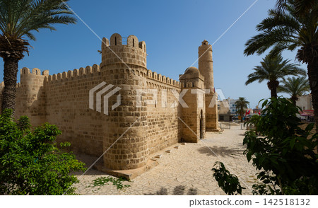 Historic fortified structure of Sousse Ribat framed by palm trees, Tunisia Historic fortified structure of Sousse Ribat framed by palm trees, Tunisia 142518132